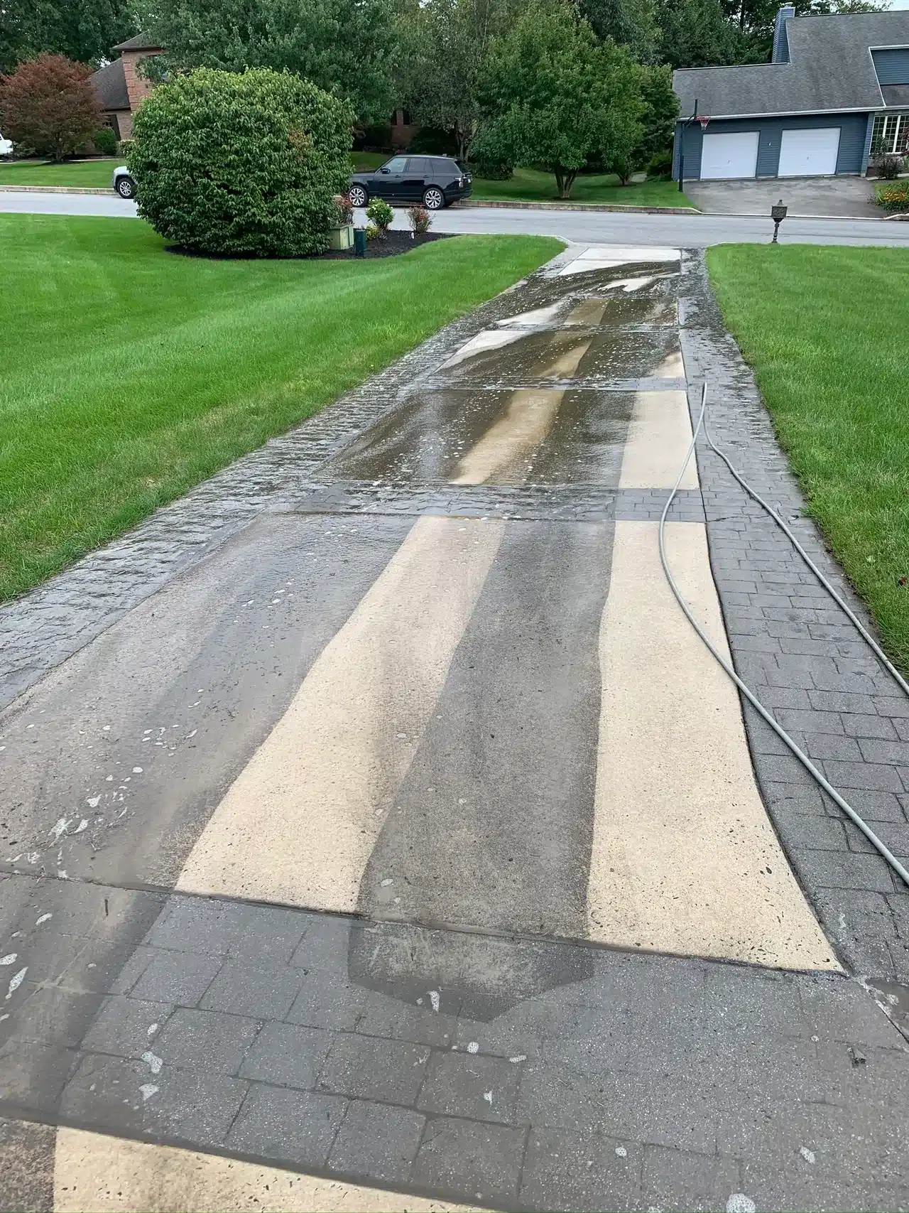 A home's drive way being cleaned.